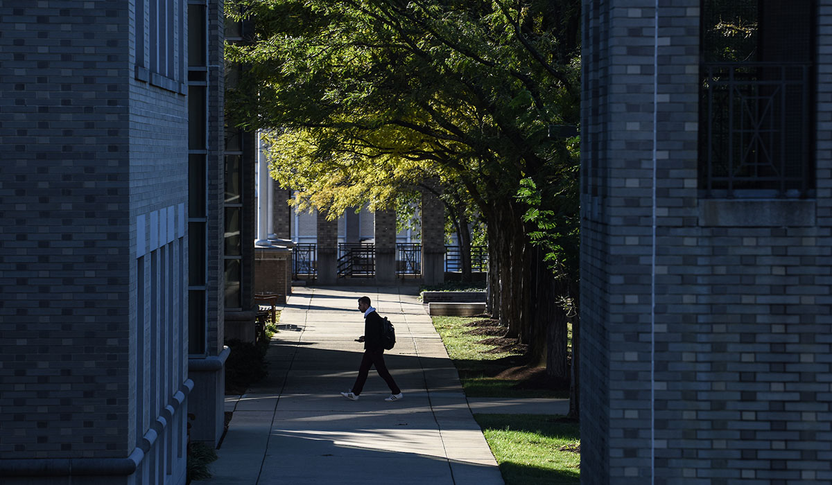 Student walking between campus buildings